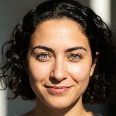 A person looking directly at the camera with clear, bright eyes after successful vision correction, symbolizing good candidacy and outcomes